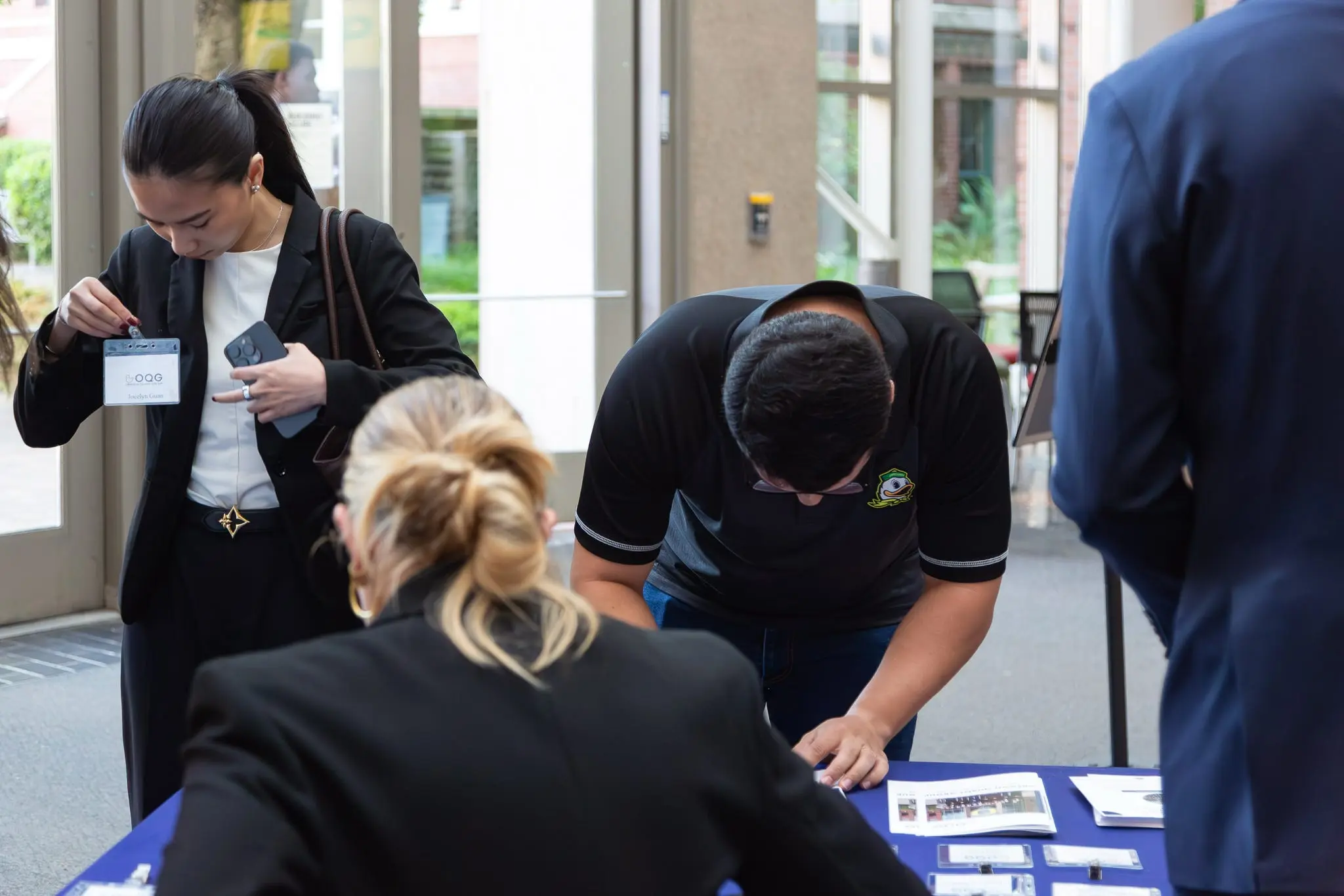Industry guests and members signing in at the OQG networking lunch