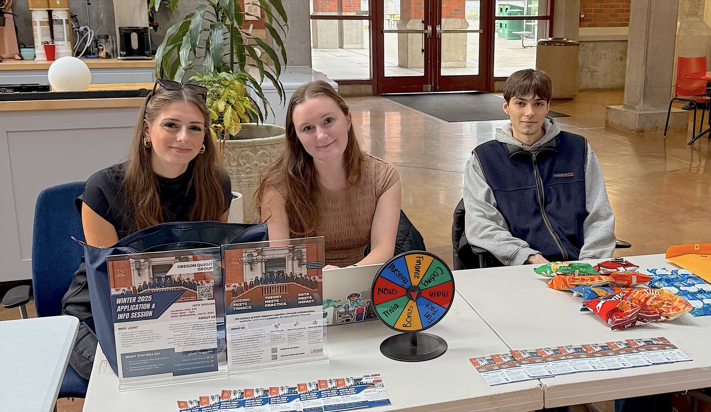 Three members staffing the OQG recruitment table
